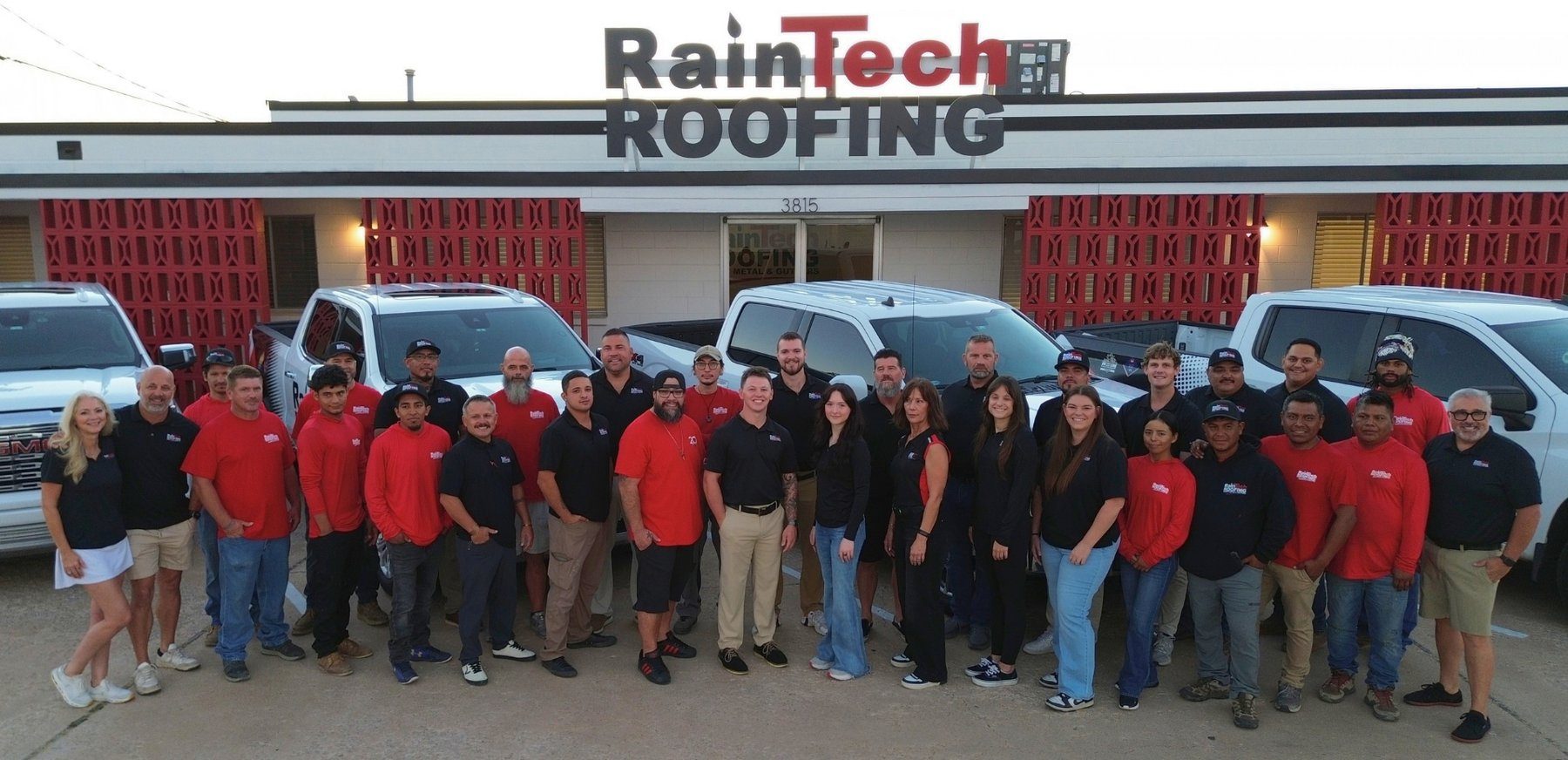 RainTech Roofing trucks and team at the shop on 79th East Avenue