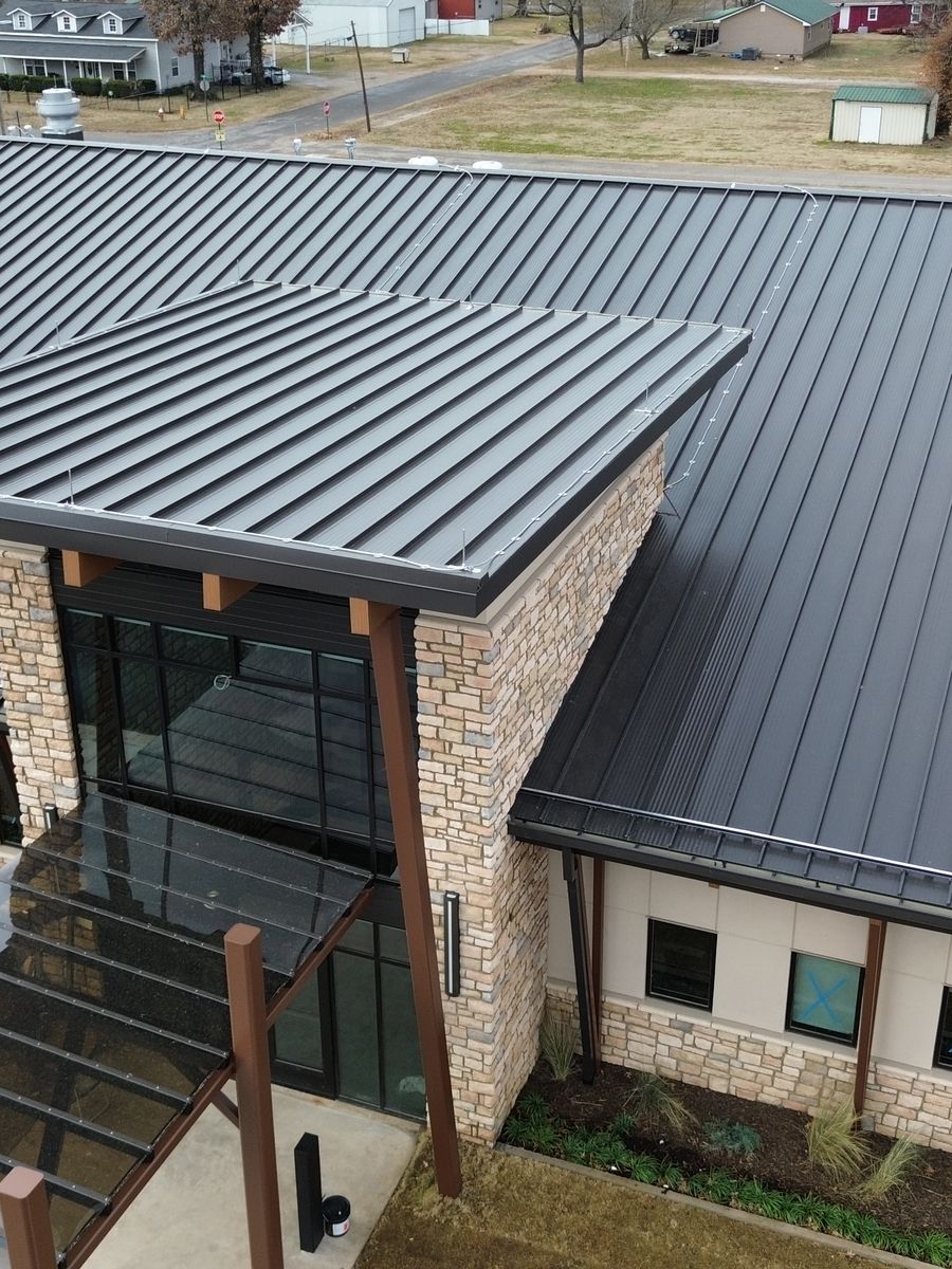 Commercial building with a dark standing seam metal roof