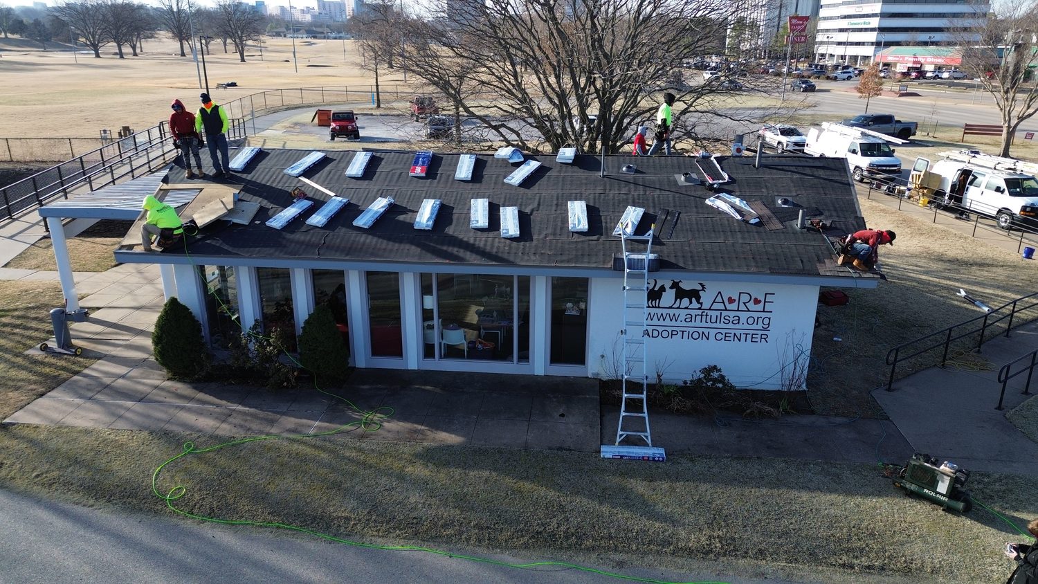 Crew re-roofing a local animal rescue center