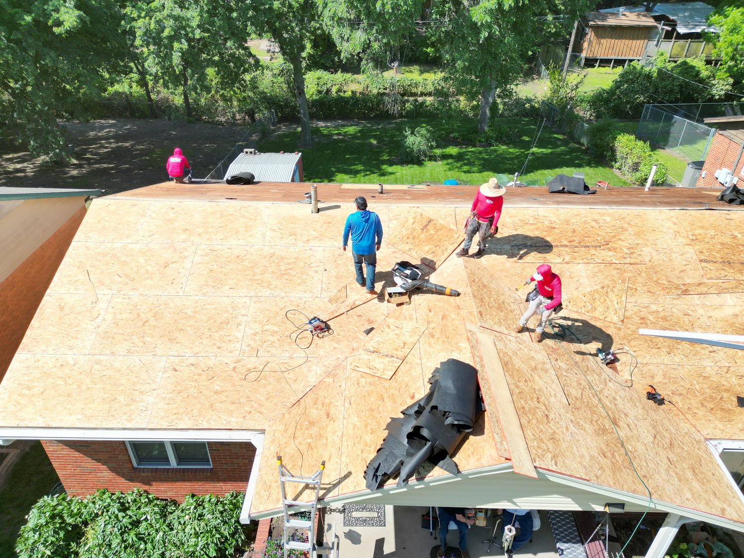 RainTech crew installing new decking on a donated roof