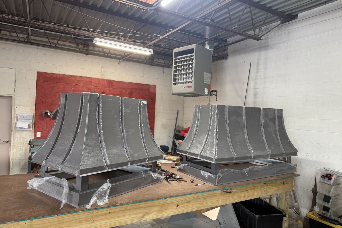 Custom metal hoods on the bench