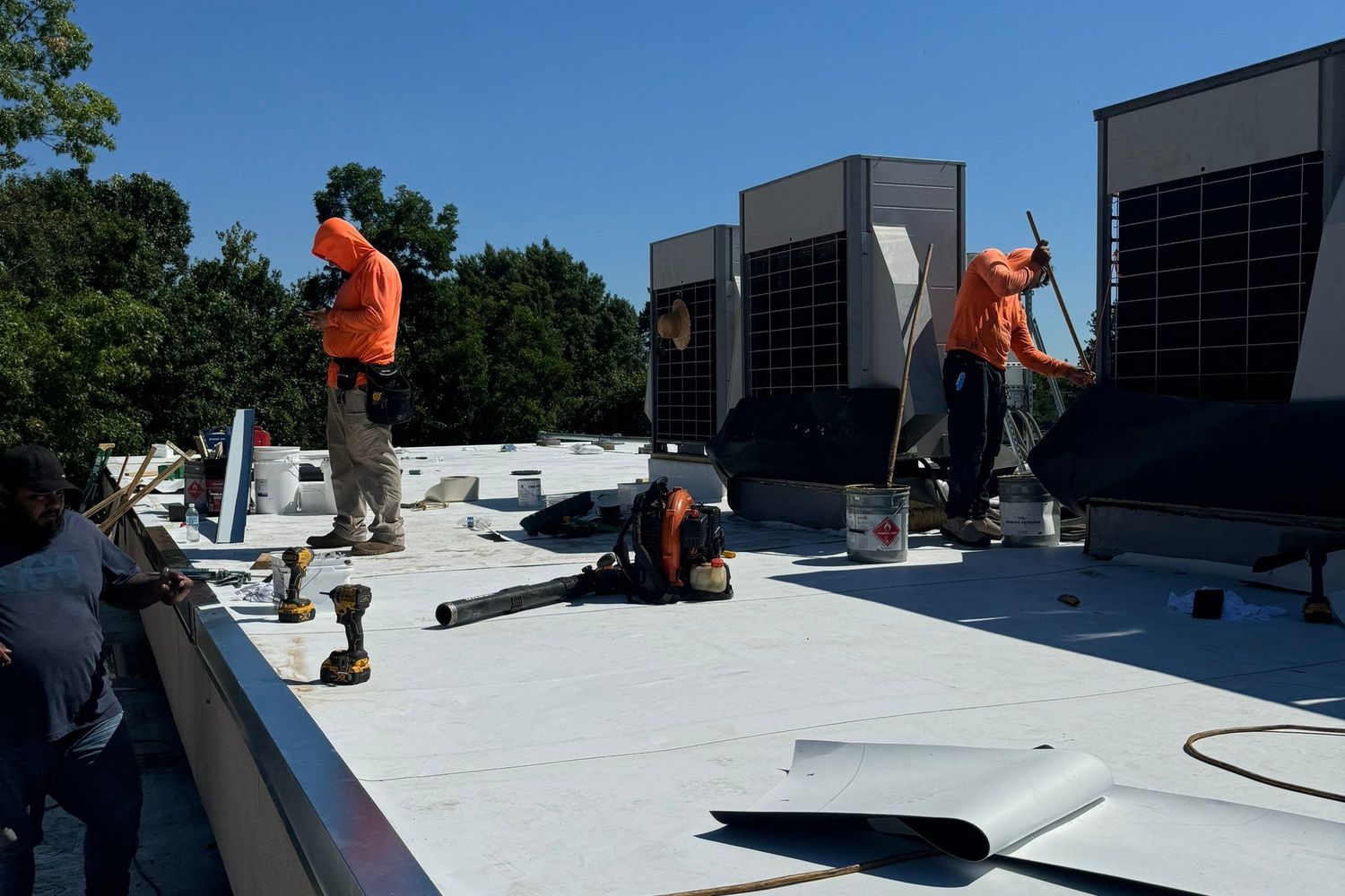 Crew detailing TPO at the parapet