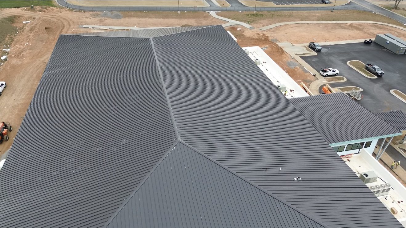 Standing seam metal roof on a commercial building, aerial