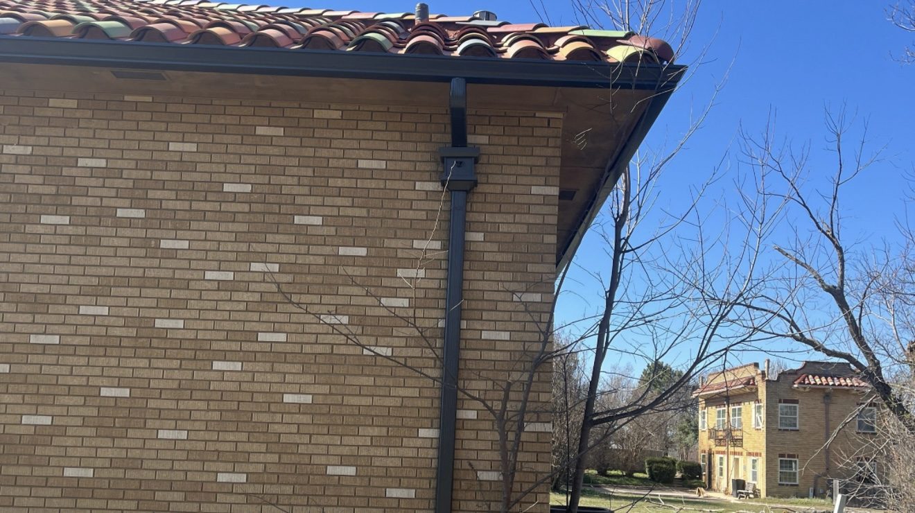 Downspout on brick and clay tile