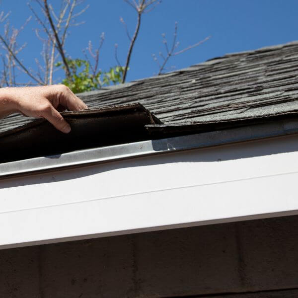Roof Inspector Checking Shingles