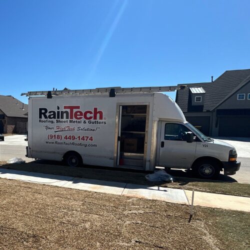 RainTech Gutter Fleet vehicle at a jobsite for a new construction home in Bixby, Oklahoma.